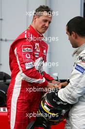 29.05.2005 Nuerburg, Germany,  Michael Schumacher (GER), Scuderia Ferrari Marlboro, Portrait (left) and Juan-Pablo Montoya (COL), West McLaren Mercedes (right), in the Parc Ferme after the race - May, Formula 1 World Championship, Rd 7, European Grand Prix, Nürburgring, GER, Podium