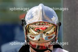 01.07.2005 Magny-Cours, France,  Michael Schumacher (GER), Scuderia Ferrari Marlboro F2005, mirrored in the visor of a fireman's helmet - July, Formula 1 World Championship, Rd 10, French Grand Prix, Magny Cours, France, Practice