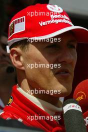 01.07.2005 Magny-Cours, France,  Michael Schumacher (GER), Scuderia Ferrari Marlboro, Portrait, being interviewed - July, Formula 1 World Championship, Rd 10, French Grand Prix, Magny Cours, France