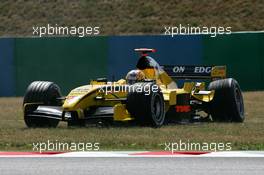 01.07.2005 Magny-Cours, France,  Tiago Monteiro (POR), Jordan Toyota EJ15, with a broken rear left suspension after flying over the curbe stones - July, Formula 1 World Championship, Rd 10, French Grand Prix, Magny Cours, France, Practice