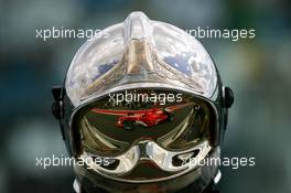 01.07.2005 Magny-Cours, France,  Michael Schumacher (GER), Scuderia Ferrari Marlboro F2005, mirrored in the helmet of a fireman - July, Formula 1 World Championship, Rd 10, French Grand Prix, Magny Cours, France, Practice