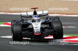 01.07.2005 Magny-Cours, France,  Kimi Raikkonen (FIN), West McLaren Mercedes MP4-20, jumping over the curbe stones - July, Formula 1 World Championship, Rd 10, French Grand Prix, Magny Cours, France, Practice