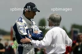 01.07.2005 Magny-Cours, France,  Bernie Ecclestone (GBR), CEO of Formula One Management (FOM) (right), talking with Mark Webber (AUS), BMW Williams F1 Team, Portrait (left) - July, Formula 1 World Championship, Rd 10, French Grand Prix, Magny Cours, France, Practice