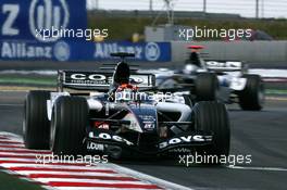 01.07.2005 Magny-Cours, France,  Christijan Albers (NED), Minardi Cosworth PS05, in front of Patrick Friesacher (AUT), Minardi Cosworth PS04B - July, Formula 1 World Championship, Rd 10, French Grand Prix, Magny Cours, France, Practice