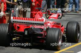 01.07.2005 Magny-Cours, France,  Rubens Barrichello (BRA), Scuderia Ferrari Marlboro F2005, in the pitlane, with a mittor on the lollypop - July, Formula 1 World Championship, Rd 10, French Grand Prix, Magny Cours, France, Practice