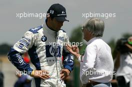 01.07.2005 Magny-Cours, France,  Bernie Ecclestone (GBR), CEO of Formula One Management (FOM) (right), talking with Mark Webber (AUS), BMW Williams F1 Team, Portrait (left) - July, Formula 1 World Championship, Rd 10, French Grand Prix, Magny Cours, France
