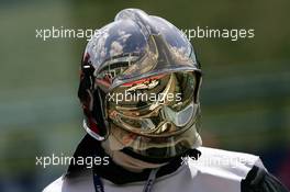 01.07.2005 Magny-Cours, France,  Takuma Sato (JPN), Lucky Strike BAR Honda 007, mirrored in the helmet of a fireman - July, Formula 1 World Championship, Rd 10, French Grand Prix, Magny Cours, France, Practice