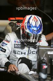 01.07.2005 Magny-Cours, France,  Kimi Raikkonen (FIN), West McLaren Mercedes, stepping into the car - July, Formula 1 World Championship, Rd 10, French Grand Prix, Magny Cours, France, Practice