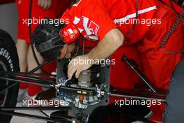 01.07.2005 Magny-Cours, France,  A Ferrari mechanic changing something on the nose of the car - July, Formula 1 World Championship, Rd 10, French Grand Prix, Magny Cours, France, Practice