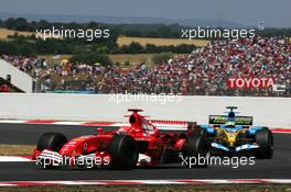 03.07.2005 Magny-Cours, France,  Michael Schumacher (GER), Scuderia Ferrari Marlboro F2005, leads Giancarlo Fisichella (ITA), Mild Seven Renault F1 R25 - July, Formula 1 World Championship, Rd 10, French Grand Prix, Magny Cours, France, Race