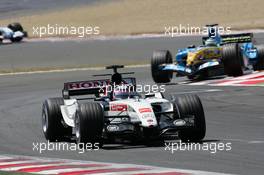 03.07.2005 Magny-Cours, France,  Takuma Sato, JPN, Lucky Strike BAR Honda 007, Action, Track leads Giancarlo Fisichella, ITA, Mild Seven Renault F1 Team, R25, Action, Track - July, Formula 1 World Championship, Rd 10, French Grand Prix, Magny Cours, France, Race