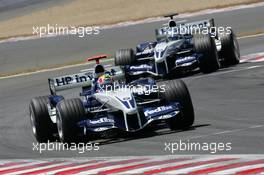03.07.2005 Magny-Cours, France,  Mark Webber, AUS, BMW WilliamsF1 Team, FW27, Action, Track leads Nick Heidfeld, GER, BMW WilliamsF1 Team - July, Formula 1 World Championship, Rd 10, French Grand Prix, Magny Cours, France, Race