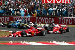 03.07.2005 Magny-Cours, France,  Start of the race, with Michael Schumacher (GER), Scuderia Ferrari Marlboro F2005, in third place, in front of Rubens Barrichello (BRA), Scuderia Ferrari Marlboro F2005, Takuma Sato (JPN), Lucky Strike BAR Honda 007, Giancarlo Fisichella (ITA), Mild Seven Renault F1 R25 and Juan-Pablo Montoya (COL), West McLaren Mercedes MP4-20 - July, Formula 1 World Championship, Rd 10, French Grand Prix, Magny Cours, France, Race