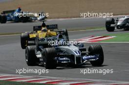03.07.2005 Magny-Cours, France,  Nick Heidfeld, GER, BMW WilliamsF1 Team, FW27, Action, Track leads Narain Karthikeyan, IND, Jordan, EJ15, Action, Track - July, Formula 1 World Championship, Rd 10, French Grand Prix, Magny Cours, France, Race