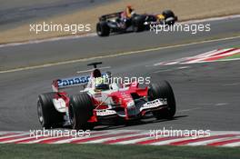 03.07.2005 Magny-Cours, France,  Ralf Schumacher, GER, Panasonic Toyota Racing, TF105, Action, Track leads David Coulthard, GBR, Red Bull Racing, RB1, Action, Track - July, Formula 1 World Championship, Rd 10, French Grand Prix, Magny Cours, France, Race