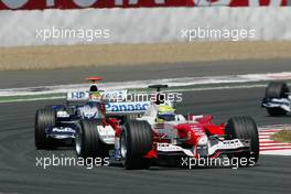 03.07.2005 Magny-Cours, France,  Ralf Schumacher, GER, Panasonic Toyota Racing, TF105, Action, Track leads Mark Webber, AUS, BMW WilliamsF1 Team, FW27, Action, Track - July, Formula 1 World Championship, Rd 10, French Grand Prix, Magny Cours, France, Race
