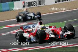 03.07.2005 Magny-Cours, France,  Ralf Schumacher, GER, Panasonic Toyota Racing, TF105, Action, Track leads Mark Webber, AUS, BMW WilliamsF1 Team, FW27, Action, Track - July, Formula 1 World Championship, Rd 10, French Grand Prix, Magny Cours, France, Race