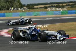 03.07.2005 Magny-Cours, France,  Mark Webber, AUS, BMW WilliamsF1 Team, FW27, Action, Track leads Nick Heidfeld, GER, BMW WilliamsF1 Team, FW27, Action, Track - July, Formula 1 World Championship, Rd 10, French Grand Prix, Magny Cours, France, Race