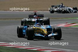 03.07.2005 Magny-Cours, France,  Fernando Alonso, ESP, Mild Seven Renault F1 Team, R25, Action, Track leads Jenson Button, GBR, Lucky Strike BAR Honda 007, Action, Track - July, Formula 1 World Championship, Rd 10, French Grand Prix, Magny Cours, France, Race
