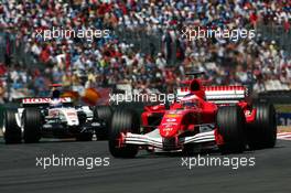 03.07.2005 Magny-Cours, France,  Rubens Barrichello (BRA), Scuderia Ferrari Marlboro F2005, leads Jenson Button (GBR), Lucky Strike BAR Honda 007 - July, Formula 1 World Championship, Rd 10, French Grand Prix, Magny Cours, France, Race