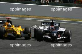 03.07.2005 Magny-Cours, France,  Christijan Albers (NED), Minardi Cosworth PS05 (right) and Tiago Monteiro (POR), Jordan Toyota EJ15 (left), fighting for position - July, Formula 1 World Championship, Rd 10, French Grand Prix, Magny Cours, France, Race