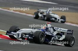 02.07.2005 Magny-Cours, France,  Mark Webber, AUS, BMW WilliamsF1 Team, FW27, Action, Track leads Nick Heidfeld, GER, BMW WilliamsF1 Team - July, Formula 1 World Championship, Rd 10, French Grand Prix, Magny Cours, France, Practice