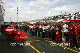 30.06.2005 Magny-Cours, France,  Fans watch the Ferrari pitboxes during the Thursday afternoon pitwalk - June, Formula 1 World Championship, Rd 10, French Grand Prix, Magny Cours, France