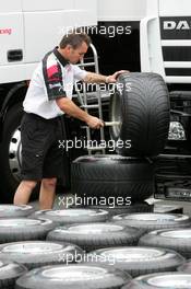 30.06.2005 Magny-Cours, France,  BAR tyre mechanic preparing the Michelin tyres - June, Formula 1 World Championship, Rd 10, French Grand Prix, Magny Cours, France