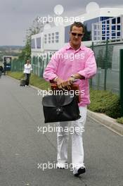 30.06.2005 Magny-Cours, France,  Michael Schumacher, GER, Ferrari arrives at the track - June, Formula 1 World Championship, Rd 10, French Grand Prix, Magny Cours, France