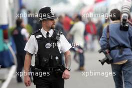 08.07.2005 Silverstone, England, a Police Men in the Paddock - July, Formula 1 World Championship, Rd 11, British Grand Prix, Silverstone, England