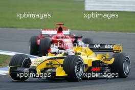 08.07.2005 Silverstone, England, Narain Karthikeyan, IND, Jordan followed by Michael Schumacher, GER, Ferrari - July, Formula 1 World Championship, Rd 11, British Grand Prix, Silverstone, England, Practice