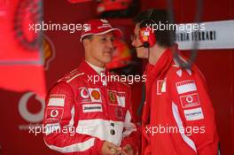 08.07.2005 Silverstone, England, Michael Schumacher (GER), Scuderia Ferrari Marlboro, Portrait, talking with his race engineer Chris Dyer (GBR) - July, Formula 1 World Championship, Rd 11, British Grand Prix, Silverstone, England, Practice