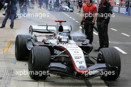 08.07.2005 Silverstone, England, Kimi Raikkonen (FIN), West McLaren Mercedes MP4-20, makes a practice start in the pitlane to lay down rubber at the position of the pitstop - July, Formula 1 World Championship, Rd 11, British Grand Prix, Silverstone, England, Practice