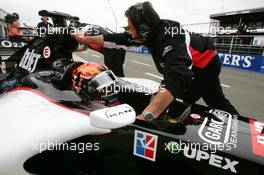 08.07.2005 Silverstone, England, Mechanics push the car of Christijan Albers (NED), Minardi Cosworth PS05, back into the pitbox - July, Formula 1 World Championship, Rd 11, British Grand Prix, Silverstone, England, Practice