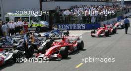 10.07.2005 Silverstone, England, Park Ferme - Michael Schumacher, GER, Ferrari, Rubens Barrichello, BRA, Ferrari - July, Formula 1 World Championship, Rd 11, British Grand Prix, Silverstone, England, Podium