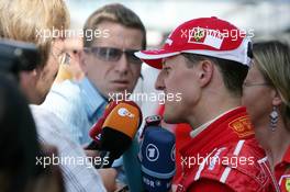 10.07.2005 Silverstone, England, Michael Schumacher (GER), Scuderia Ferrari Marlboro, Portrait, talking with the German press after the race after a dissapointing 6th place - July, Formula 1 World Championship, Rd 11, British Grand Prix, Silverstone, England, Podium