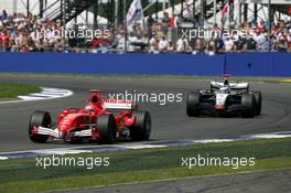 10.07.2005 Silverstone, England, Michael Schumacher (GER), Scuderia Ferrari Marlboro F2005, leads Kimi Raikkonen (FIN), West McLaren Mercedes MP4-20 - July, Formula 1 World Championship, Rd 11, British Grand Prix, Silverstone, England, Race