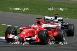 10.07.2005 Silverstone, England, Michael Schumacher, GER, Scuderia Ferrari Marlboro, F2005, Action, Track leads Kimi Raikkonen, FIN, Räikkönen, West McLaren Mercedes, MP4-20, Action, Track - July, Formula 1 World Championship, Rd 11, British Grand Prix, Silverstone, England, Race