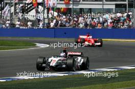 10.07.2005 Silverstone, England, Jenson Button (GBR), Lucky Strike BAR Honda 007, leads Rubens Barrichello (BRA), Scuderia Ferrari Marlboro F2005 - July, Formula 1 World Championship, Rd 11, British Grand Prix, Silverstone, England, Race