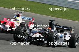 10.07.2005 Silverstone, England, Christijan Albers, NED, Minardi Cosworth, Action, Track leads Ralf Schumacher, GER, Panasonic Toyota Racing, TF105, Action, Track - July, Formula 1 World Championship, Rd 11, British Grand Prix, Silverstone, England, Race