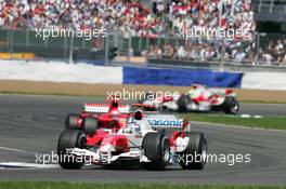 10.07.2005 Silverstone, England, Jarno Trulli, ITA, Toyota, Panasonic Toyota Racing, TF105, Action, Track leads Michael Schumacher, GER, Scuderia Ferrari Marlboro, F2005, Action, Track - July, Formula 1 World Championship, Rd 11, British Grand Prix, Silverstone, England, Race