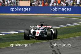 10.07.2005 Silverstone, England, Takuma Sato (JPN), Lucky Strike BAR Honda 007, going wide at the Copse corner - July, Formula 1 World Championship, Rd 11, British Grand Prix, Silverstone, England, Race