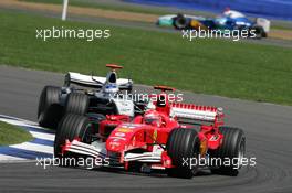 10.07.2005 Silverstone, England, Michael Schumacher, GER, Scuderia Ferrari Marlboro, F2005, Action, Track leads Kimi Raikkonen, FIN, Räikkönen, West McLaren Mercedes, MP4-20, Action, Track - July, Formula 1 World Championship, Rd 11, British Grand Prix, Silverstone, England, Race