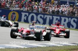 10.07.2005 Silverstone, England, Jarno Trulli, ITA, Toyota, Panasonic Toyota Racing, TF105, Action, Track leads Michael Schumacher, GER, Scuderia Ferrari Marlboro, F2005, Action, Track - July, Formula 1 World Championship, Rd 11, British Grand Prix, Silverstone, England, Race