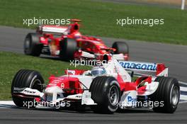 10.07.2005 Silverstone, England, Jarno Trulli, ITA, Toyota, Panasonic Toyota Racing, TF105, Action, Track leads Michael Schumacher, GER, Scuderia Ferrari Marlboro, F2005, Action, Track - July, Formula 1 World Championship, Rd 11, British Grand Prix, Silverstone, England, Race