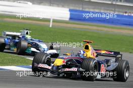 10.07.2005 Silverstone, England, David Coulthard, GBR, Red Bull Racing, RB1, Action, Track leads Felipe Massa, BRA, Sauber Petronas C24, Track, Action - July, Formula 1 World Championship, Rd 11, British Grand Prix, Silverstone, England, Race