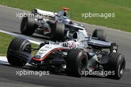 10.07.2005 Silverstone, England, Juan-Pablo Montoya, COL, Juan Pablo, West McLaren Mercedes, MP4-20, Action, Track and Kimi Raikkonen, FIN, Räikkönen, West McLaren Mercedes, MP4-20, Action, Track - July, Formula 1 World Championship, Rd 11, British Grand Prix, Silverstone, England, Race