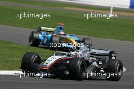 10.07.2005 Silverstone, England, Juan-Pablo Montoya, COL, Juan Pablo, West McLaren Mercedes, MP4-20, Action, Track leads Fernando Alonso, ESP, Mild Seven Renault F1 Team, R25, Action, Track - July, Formula 1 World Championship, Rd 11, British Grand Prix, Silverstone, England, Race