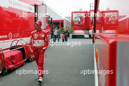 09.07.2005 Silverstone, England, Michael Schumacher, GER, Ferrari is walking between the Ferrari Trucks - July, Formula 1 World Championship, Rd 11, British Grand Prix, Silverstone, England, Practice