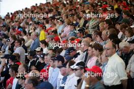 10.07.2005 Silverstone, England, People on the grandstand holding one minute of silence to remember the death from last Thursday's bomming in London - July, Formula 1 World Championship, Rd 11, British Grand Prix, Silverstone, England